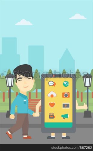 An asian young man walking with a big smartphone. Man and big smartphone in the park. Man holding the hand of smartphone. Smartphone addiction. Vector flat design illustration. Vertical layout.. Man walking with big smartphone.