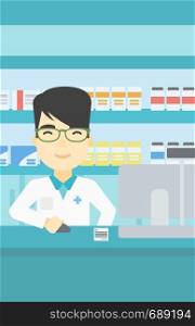 An asian young pharmacist in medical gown standing at pharmacy counter and working on a computer. Male pharmacist in the drugstore. Vector flat design illustration. Vertical layout.. Pharmacist at counter with cash box.