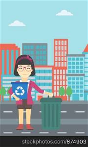 An asian young woman carrying recycling bin. Woman with recycling bin standing near a trash can on a city background. Vector flat design illustration. Vertical layout.. Woman with recycle bin and trash can.