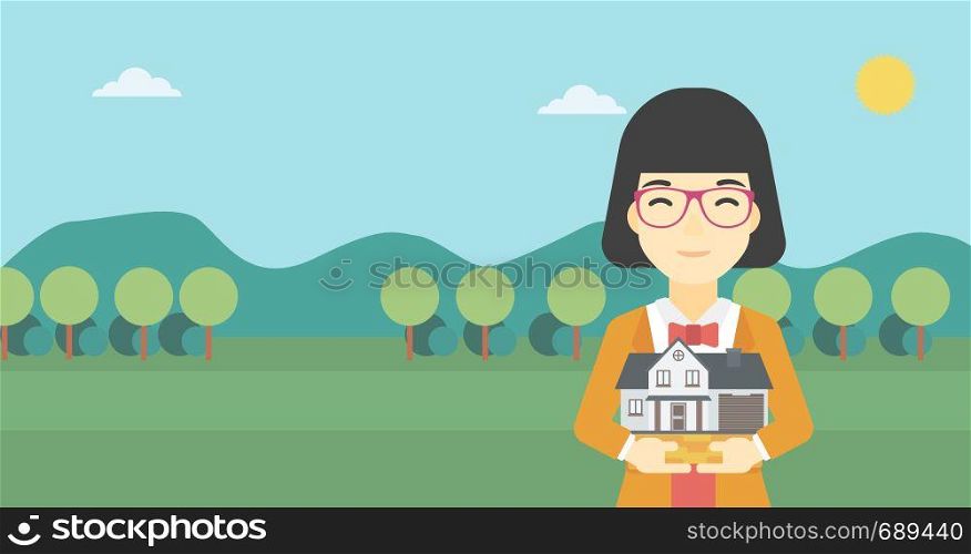 An asian young woman holding house model in hands on the background of mountains. Real estate agent with house model in hands. Vector flat design illustration. Horizontal layout.. Woman holding house model vector illustration.