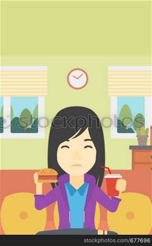 An asian young woman sitting on a sofa while eating hamburger and drinking soda on the background of living room. Vector flat design illustration. Vertical layout.. Woman eating hamburger vector illustration.