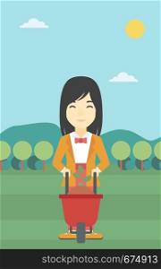 An asian young woman standing with a plant and soil in a wheelbarrow on the background of mountain landscape. Vector flat design illustration. Vertical layout.. Woman with plant and wheelbarrow.