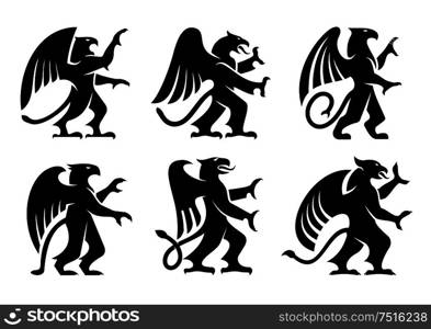 Ancient heraldic griffins symbols of black majestic beasts with body of lion, angel wings and eagle heads. For heraldic design or tattoo. Heraldic griffins with raised paws