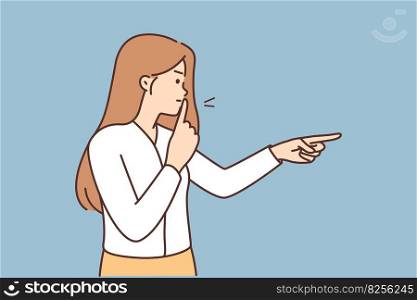 Angry woman puts finger to lips to urge quiet and not make noise during important meeting or school lesson. Nervous girl makes shh gesture and points to side ordering to observe quiet. Angry woman puts finger to lips to urge quiet and not make noise during important meeting