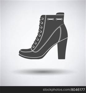 Ankle boot icon on gray background with round shadow. Vector illustration.