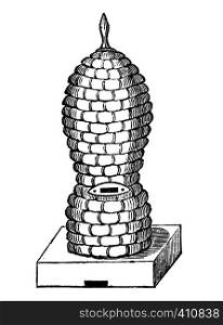 Antique vector drawing or engraving of vintage classic Straw beehive or bee hive or skep. Illustration from book Illustrierter Neuester Bienenfreund, printed in Leipzig, Germany 1852.. Vintage Vector Drawing or Engraving of Antique Old Style Bee Hive or Beehive Made From Straw