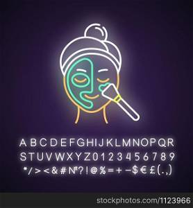 Applying thermal mask neon light icon. Skin care procedure. Face product for cleansing. Dermatology, cosmetics, makeup. Glowing sign with alphabet, numbers and symbols. Vector isolated illustration