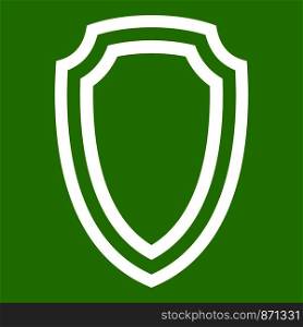 Army shield icon white isolated on green background. Vector illustration. Army shield icon green