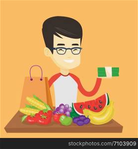 Asian male shopper standing at the table with grocery purchases. Young shopper holding money in hand in front of table with grocery purchases. Vector flat design illustration. Square layout.. Man standing at the table with shopping bag.