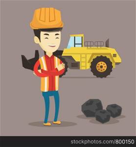 Asian smiling male miner in hard hat standing on the background of a big excavator. Confident miner in helmet with crossed arms standing near coal. Vector flat design illustration. Square layout.. Miner with a big excavator on background.