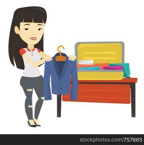 Asian woman putting jacket into a suitcase. Young business woman packing her clothes in an opened suitcase. Woman preparing for vacation. Vector flat design illustration isolated on white background.. Young woman packing suitcase vector illustration
