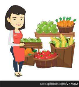 Asian worker of grocery store standing in front of section with vegetables and fruits. Worker of grocery store holding a box with apples. Vector flat design illustration isolated on white background.. Supermarket worker with box full of apples.