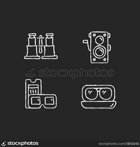 Authentic vintage chalk white icons set on dark background. Collectible binoculars. Old photo camera. Retro movie theater. Aviator sunglasses. Isolated vector chalkboard illustrations on black. Authentic vintage chalk white icons set on dark background