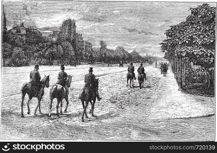 Avenue Foch or Avenue du Bois de Boulogne in Paris, France, during the 1890s, vintage engraving. Old engraved illustration of Avenue Foch with horse riders on the road.