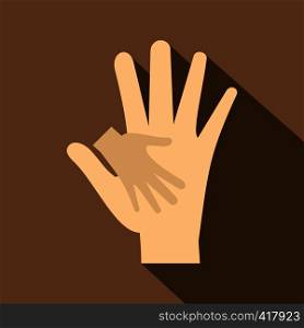 Baby hand in mother hand icon. Flat illustration of baby hand in mother hand vector icon for web isolated on coffee background. Baby hand in mother hand icon, flat style