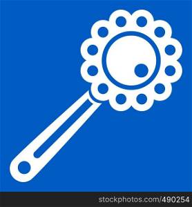 Baby rattle icon white isolated on blue background vector illustration. Baby rattle icon white