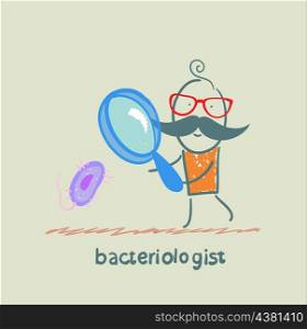 bacteriologist looks through a magnifying glass on microbes