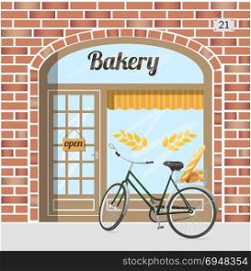 Bakery shop building facade of red bricks. Bakery shop building facade of red bricks . Bicycle with bread in basket. EPS 10 vector.