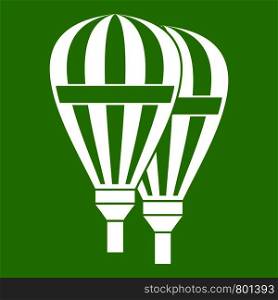 Balloons icon white isolated on green background. Vector illustration. Balloons icon green