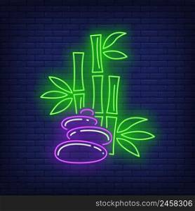 Bamboo and stones neon sign. Spa, Asia, massage design. Night bright neon sign, colorful billboard, light banner. Vector illustration in neon style.