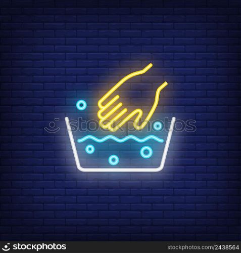 Basin with soapy water and hand neon sign. Laundry and housework concept. Advertisement design. Night bright neon sign, colorful billboard, light banner. Vector illustration in neon style.