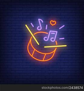 Beating drum neon sign. Red drum with sticks and melody symbols. Night bright advertisement. Vector illustration in neon style for music and parade