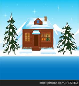Beautiful house in winter wood amongst mountains. Beautiful house beside yard in winter