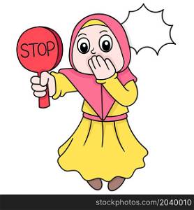 beautiful women wearing muslim hijab carrying stop sign