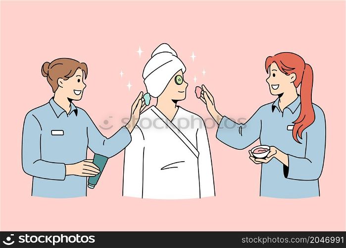 Beauty spa and cosmetology concept. Smiling women dermatologists wellness workers standing taking care of female client skin making beauty treatments vector illustration . Beauty spa and cosmetology concept.