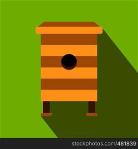 Beehive flat icon. Beehive with honey bees on a green background. Organic beekeeping. Beehive flat icon