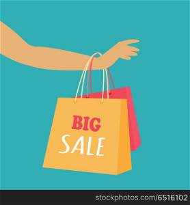Big Sale Vector Concept in Flat Design. Big sale in woman s clothing store. Color shopping paper bags hanging on a female hand flat vector illustration on blue background. Black friday. For seasonal sales and discounts promotions design. Big Sale Vector Concept in Flat Design
