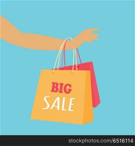 Big Sale Vector Concept in Flat Design. Big sale in woman s clothing store. Color shopping paper bags hanging on a female hand flat vector illustration on blue background. Black friday. For seasonal sales and discounts promotions design