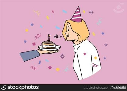 Birthday woman blows out candle on piece of cake celebrating anniversary and making cherished wish. Girl in birthday hat stands among confetti celebrating day of angel and dreaming about future. Birthday woman blows out candle on piece of cake celebrating anniversary and making cherished wish