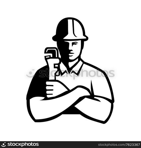 Black and white illustration of a pipefitter, a tradesperson who install, fabricate, maintain and repair mechanical piping systems, holdimg a pipe wrench viewed from front in retro style.. Pipefitter Holding Pipe Wrench Arms Folded Front View Black and White