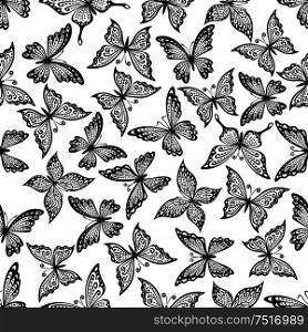 Black and white vintage seamless flying butterflies pattern with decorative wings, adorned by delicate curly ornaments. Great for nature background, elegant fabric print or interior design . Vintage ornamental butterflies seamless pattern