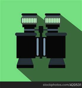 Black binoculars flat icon on a green background. Black binoculars flat icon