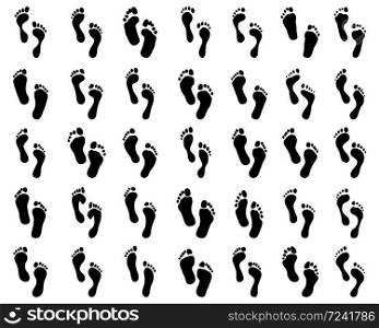 Black prints of human feet on a white background