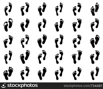 Black prints of human feet on a white background