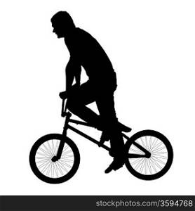 Black silhouette of a young man on a bike