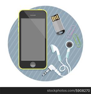 Black smartphone with headphones and memory card on stylish background. Smartphone with headphones