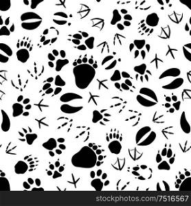 Black tracks of animals and birds seamless pattern over white background. Nature or wildlife theme or scrapbook page backdrop design. Black and white animal tracks pattern
