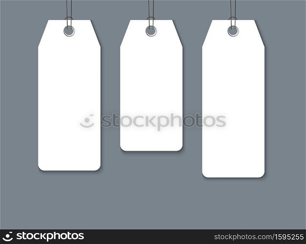 Blank paper label or cloth tag set isolated on dark background. Composition for promo and sale design. Blank paper label or cloth tag set isolated