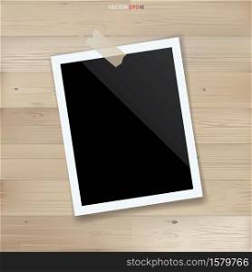 Blank photo frame or picture frame on wood background. Vector illustration.
