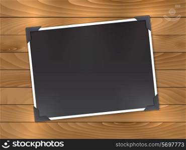 Blank photo on a wooden background