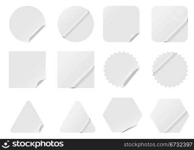 Blank white stickers isolated on white background.