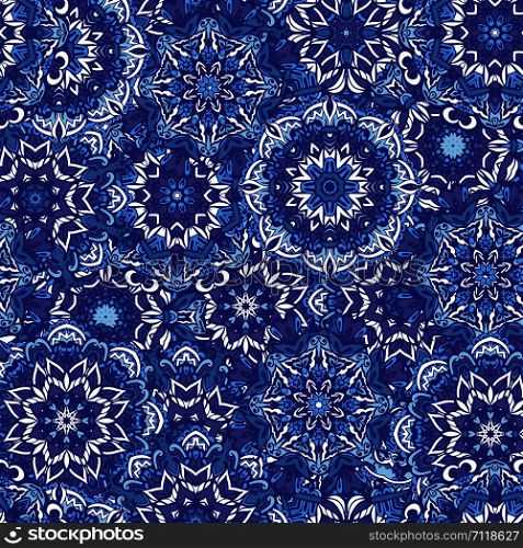 Blue mandala flower circles and snowflakes Damask seamless pattern blue background. Abstract floral blue ornamental circles mandala seamless pattern