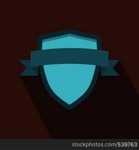 Blue shield with ribbon icon in flat style on a light brown background. Blue shield with ribbon icon, flat style