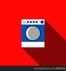 Blue washing machine icon in flat style on a red background. Blue washing machine icon, flat style