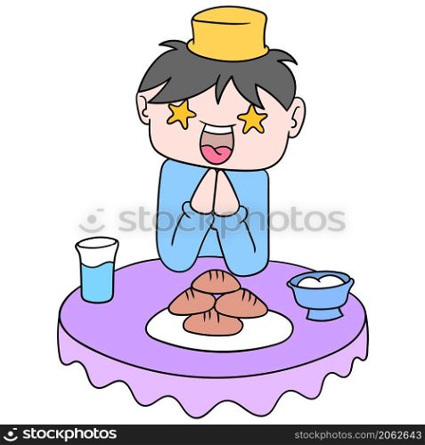 boy is happy at the dining table when breaking the fast of ramadhan kareem