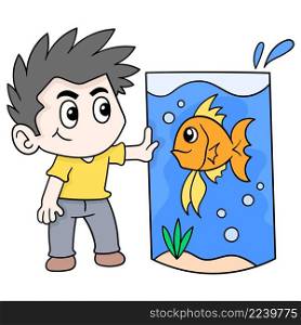 boy is raising fish in a big aquarium